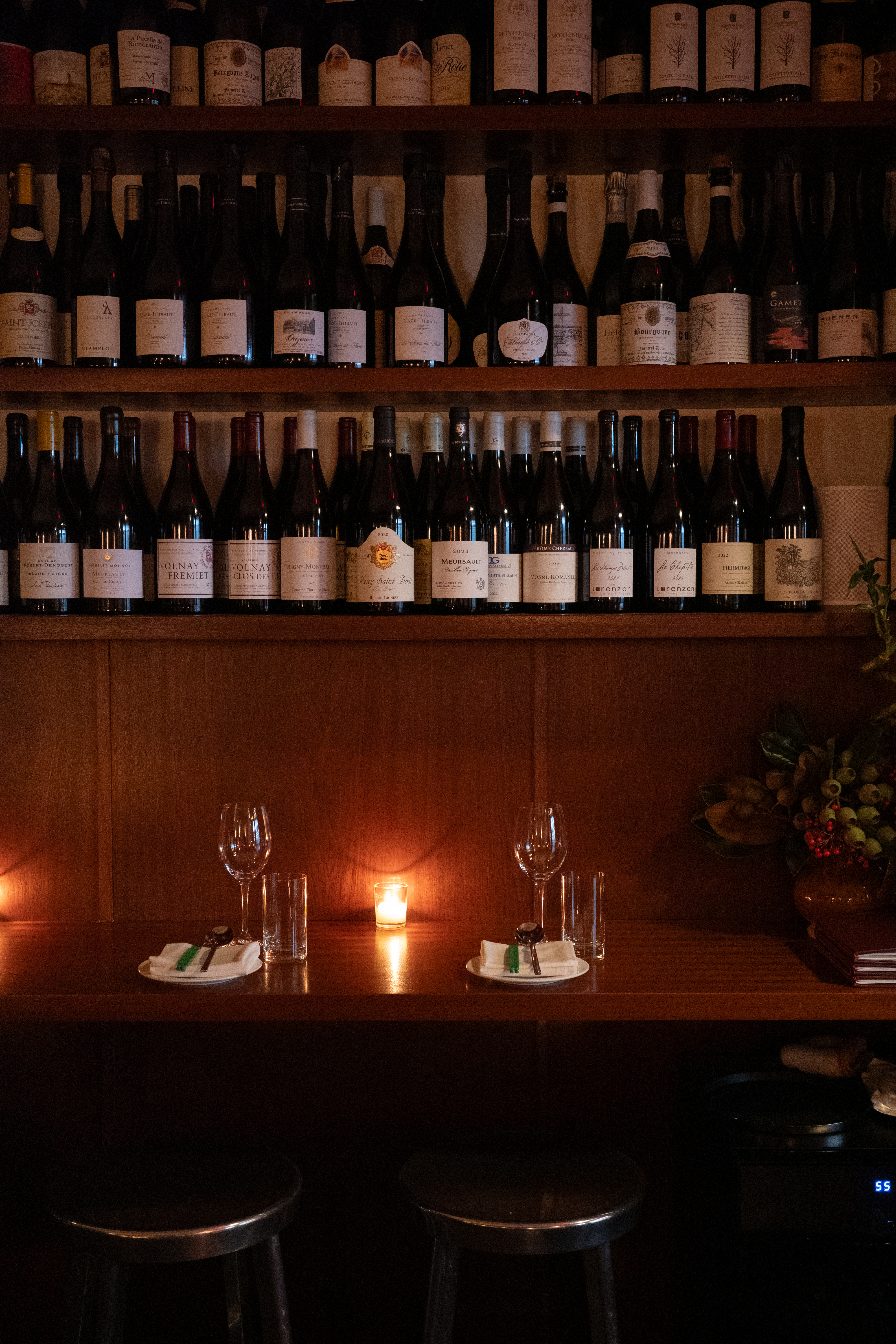 Left: Counter seating. Right: Chilled celtuce and a glass of wine.